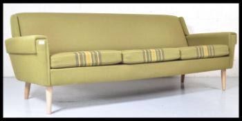 A mid 20th century retro vintage Scandinavian three seat sofa settee having an angular and winged
