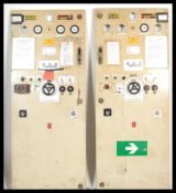 A pair of vintage Ministry Of Defence metal instrument doors, the doors fitted with several gauges