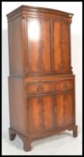 A Bevan and Funnell Reprodux  flame mahogany four door bow fronted cocktail / drinks cabinet.