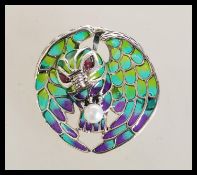 A stamped 925 silver and plique a jour brooch in the form of an owl set with a pearl and red stone