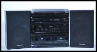 A 20th Century Technics music stacking system, consisting of record deck, tape deck, radio