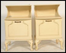 A pair of 20th century shabby chic French Louis 16th revival bedside cabinet raised on sabre style