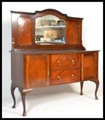 A 1920's flame mahogany mirror back sideboard. Raised on squared legs  supporting a  sideboard
