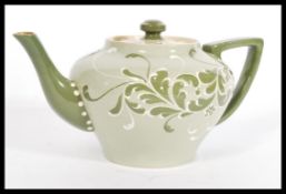 A 19th Century Victorian early Moorcroft James Macintyre Faience ware teapot having tubelined