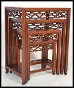 A 20th century Oriental Chinese hardwood quartetto nest of four graduating tables.The rectangular