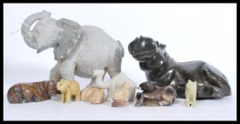 A collection of African carved soapstone figurines