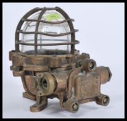A  20th century Industrial heavy / extreme duty pendant bulkhead lamp light having a caged glass