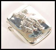 A sterling silver vesta case having embossed decoration in relief of a cowboy riding a horse. Weight