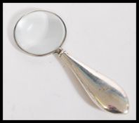 An early 20th century silver hallmarked small magnifying glass by Henry Matthews. Hallmarked for