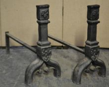 A pair of 19th century French cast iron fire irons - andirons having ebonised finish with ram head
