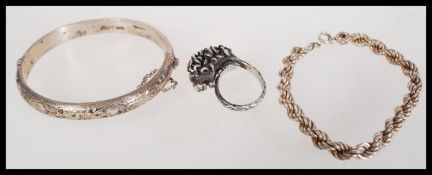 A group of silver hallmarked jewellery to include a bangle bracelet, rope twist bracelet and
