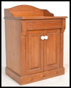 A Victorian pine washstand - hall cabinet. The cabinet of pedestal form with gallery top over