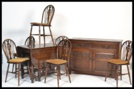 A Jaycee / Old Charm dining room suite comprising a set of 6 wheelback dining chairs, a drop leaf