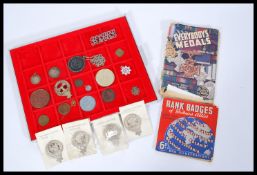 A collection of badges and to include a selection of Scottish Clan Crest brooches, a Queen