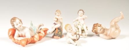 A COLLECTION OF FINE PORCELAIN CHERUB PUTTI FIGURINES