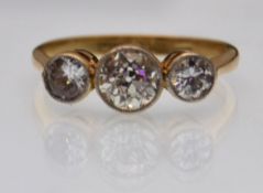 18CT GOLD PLATINUM THREE STONE DIAMOND RING.
