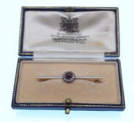 EARLY 20TH CENTURY PLATINUM RUBY AND DIAMOND CLUSTER BAR BROOCH