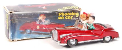 JAPANESE TINPLATE BATTERY OPERATED ' PHOTOING ON CAR ' TINPLATE