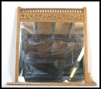 A large 19th Century gesso overmantel wall mirror,