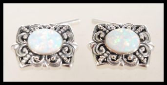 A pair of sterling silver cufflinks having large c