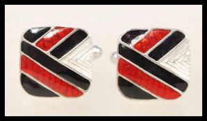A pair of sterling silver enamel cufflinks having