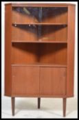 A retro Danish inspired teak wood corner unit disp