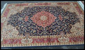 A large Persian floor carpet Keshan rug having a b