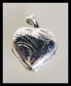 A sterling silver four leaf clover double locket p