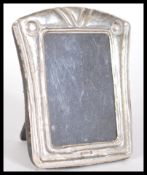 A sterling silver miniature easel back picture fra