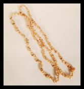 Two vintage 20th Century necklaces of strung Pacif