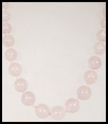 A rose quartz beaded necklace having round beads w
