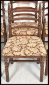 A set of six 20th Century oak ladder back dining c