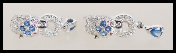 A pair of sterling silver and CZ earrings in the f