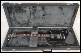 A Vintage SG style electric six string guitar, hav