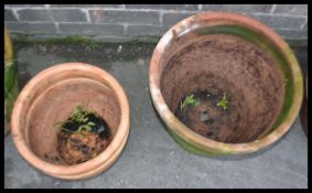 A collection of vintage terracotta stone garden pl
