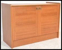 A retro 20th Century teak wood low sideboard enter