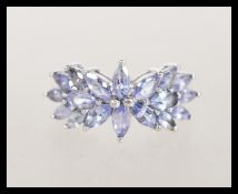 A hallmarked 9ct white gold multi blue stone ring