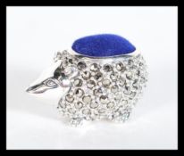 A sterling silver and marcasite set pincushion in