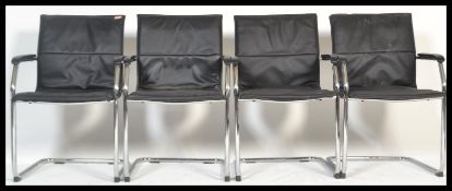 A set of 4 retro style chrome cantilever dining ch