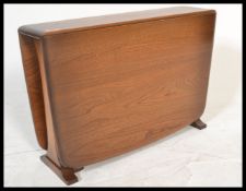 An Ercol Windsor pattern Golden Dawn drop leaf sid