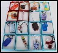 A selection of art glass pendants of different col