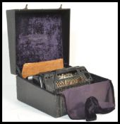 A 20th Century Super Condovox piano accordion having 120 buttons and 24 keys, having a black case