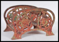 A 19th Century Victorian cast iron double sided boot scrape the open sided fret decorated with