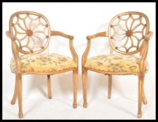 A pair of  cartwheel back Chippendale gilt mahogany dining chairs. Each with overstuffed seats