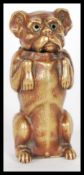 An early 20th Century vintage brass vesta case in the form of a begging dog with ornate detailing