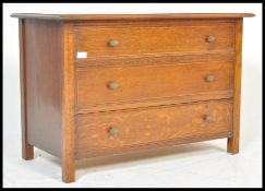 An early 20th Century Art Deco vintage tiger oak chest of drawers. The bank of three straight