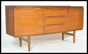 A retro mid 20th Century teak wood bow front sideboard / credenza with a central bank of three