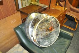 A group of three 20th Century convex wall security mirrors, both retaining original wall bracket /