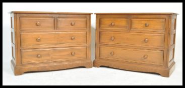 A pair of 20th century Ercol elm wood Golden Dawn chest of drawers. Each raised on plinth bases with