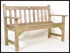 A vintage  country teak wood R.A. Lister of Dursley two seater garden bench having ladder backrest